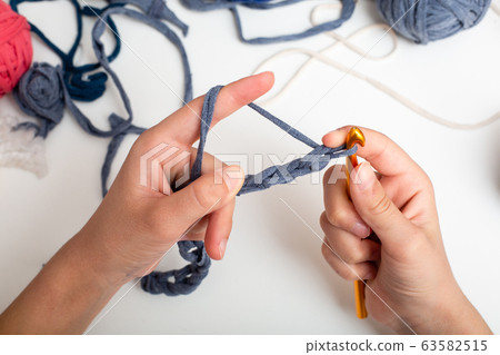 Childrens hands are crocheted and thread 63582515