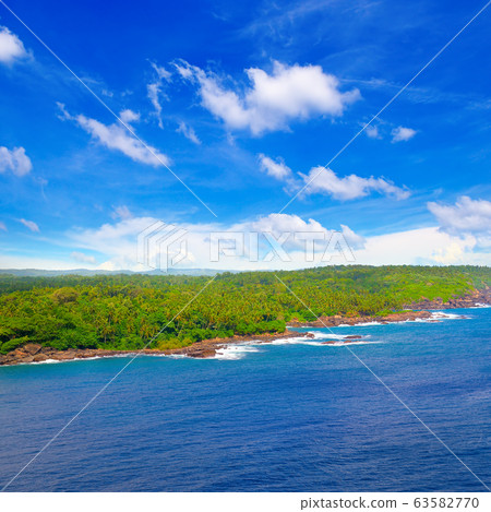 Bright turquoise water and a beautiful beach with 63582770