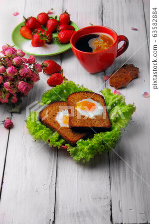 Toast with fried eggs. Coffee.Breakfast 63582884