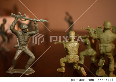 A Shot of Toy Army Men in Combat 63583441