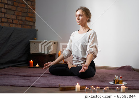 Beautiful young caucasian girl sitting in a room 63583844