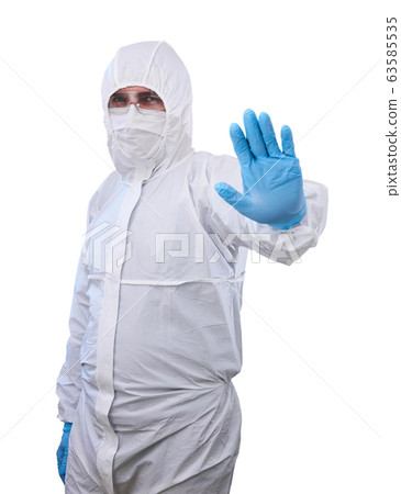 epidemiologist in a protective suit shows 63585535