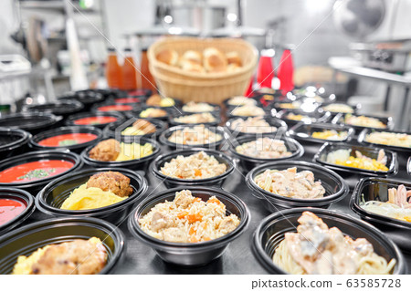 Row of plastic disposable lunch box with healthy natural food. Soups, cream soup, main course with side dish, salads. Food delivery. Lunch in the office. Row of plastic disposable lunch box with healthy natural food. Soups, cream soup, main course with side dish, salads. Food delivery. Lunch in the office. 63585728