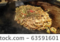 Japanese yaki soba on a iron plate ready to serve 63591601