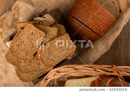 Slices of brown bread in basket 63593019