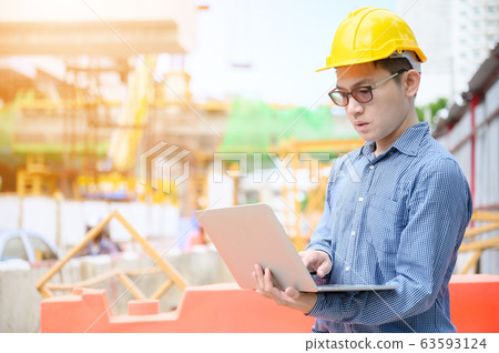 Young asian engineers are working on the construction site Young asian engineers are working on the construction site 63593124