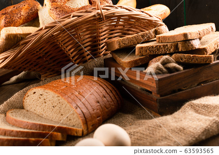 Slices of brown bread in basket 63593565