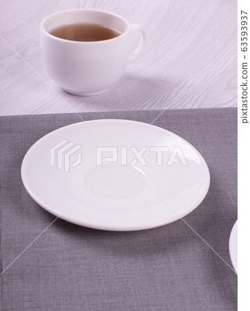 Cup of tea and saucer Cup of tea and saucer 63593937