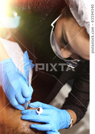 applying Tottoo, Brow Microblading to customer applying Tottoo, Brow Microblading to customer 63594340