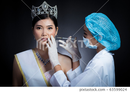 Miss Beauty Queen Pageant Contest with Diamond crown sash is checked up by Beautician Doctor and recommend consult before Syringe injection skincare medical chemical to her face, plastic surgery Miss Beauty Queen Pageant Contest with Diamond crown sash is checked up by Beautician Doctor and recommend consult before Syringe injection skincare medical chemical to her face, plastic surgery 63599024