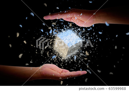 Abstract cube floating in palm 63599988