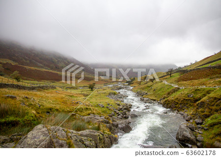 Lake District foggy landscape in the Autumn Lake District foggy landscape in the Autumn 63602178