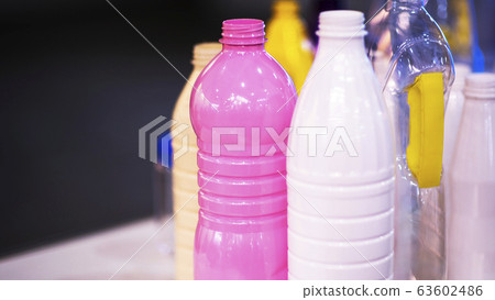 closeup group of colorful empty plastic bottles 63602486