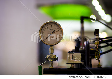 pressure gauge psi meter in pipe and valves of 63602659
