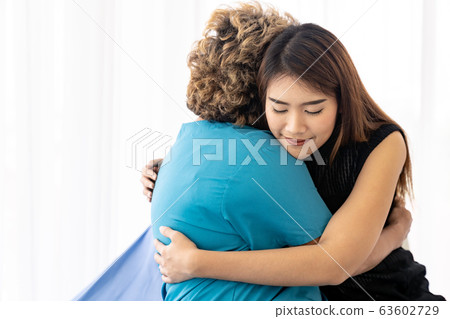 Daughter hug elderly mother 63602729