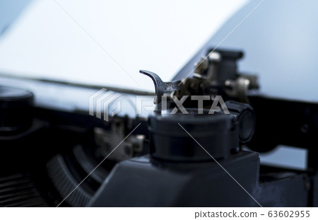 Old vintage typewriter with a blank sheet of paper Old vintage typewriter with a blank sheet of paper 63602955