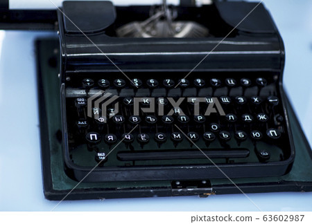 Close up photo of antique typewriter keys, shallow Close up photo of antique typewriter keys, shallow 63602987