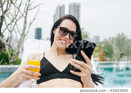 Young woman checking social media 63603004