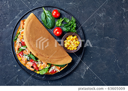 Murtabak with shrimps, cheese, spinach, copy space Murtabak with shrimps, cheese, spinach, copy space 63605009