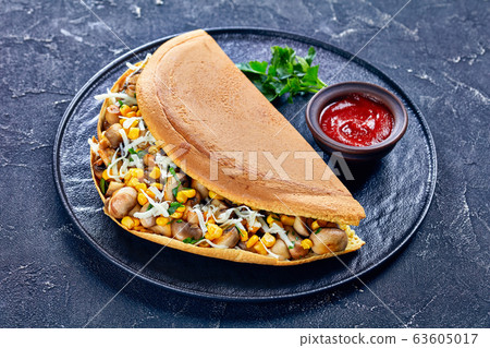 Turnover pancake with corn, cheese, and mushrooms Turnover pancake with corn, cheese, and mushrooms 63605017