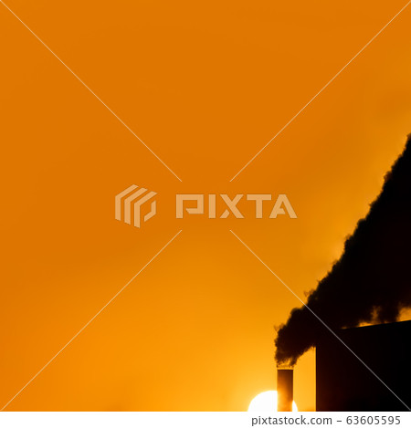 Tube with black smoke and huge sun with text space 63605595