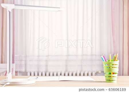 children's school desk with a lamp, pencils and window 63606189