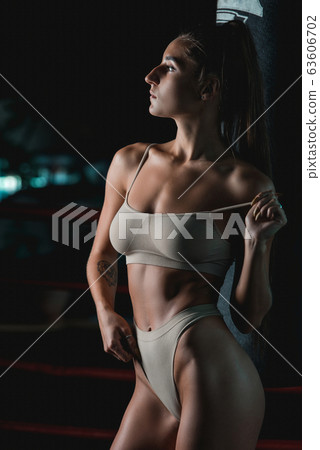 Fashionable brunette girl in a biege underwear Fashionable brunette girl in a biege underwear 63606702