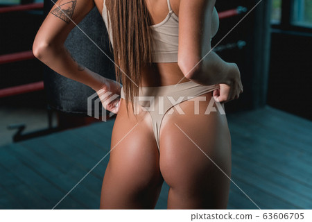 Fashionable brunette girl in a biege underwear Fashionable brunette girl in a biege underwear 63606705