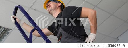 Workman having backache at job Workman having backache at job 63608249