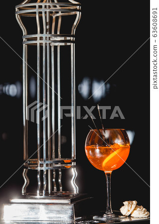 glass of refreshing orange alcoholic cocktail on a 63608691