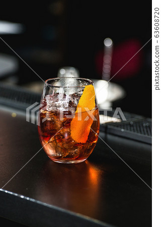 refreshing red coctail with orange isolated on a 63608720