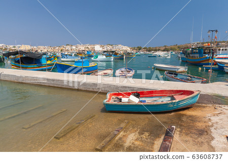 Fishing boat lay on a coast in Marsaxlokk town, Fishing boat lay on a coast in Marsaxlokk town, 63608737