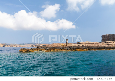 Beacon on a rocky coast of Comino island, Malta Beacon on a rocky coast of Comino island, Malta 63608756