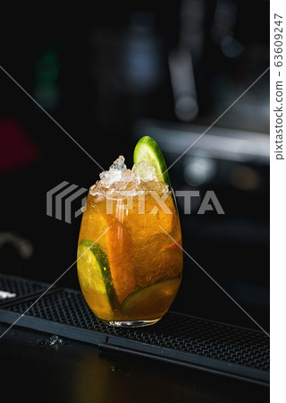 orange margareta fresh Cocktail on a table in bar orange margareta fresh Cocktail on a table in bar 63609247