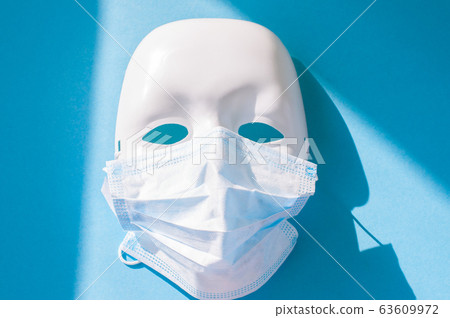 Medical mask on a white plastic face mask. Blue Medical mask on a white plastic face mask. Blue 63609972