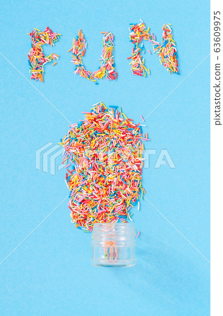 Colorful pastry sprinkes background. "Fun" word Colorful pastry sprinkes background. "Fun" word 63609975