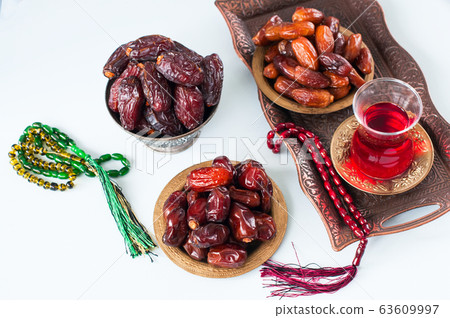 Assorted dried dates or kurma in a vintage plates 63609997