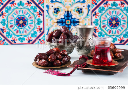 Assorted dried dates or kurma in a vintage plates Assorted dried dates or kurma in a vintage plates 63609999