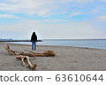 Seaside woman back view 63610644