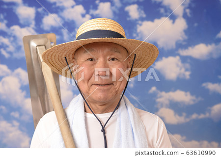 Senior farmer with hoe Senior farmer with hoe 63610990