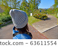 Soap bubbles with park and woman 63611554