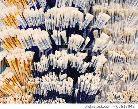 Group of artistic paintbrushes. New paint brushes on shelf display in stationery shop. Group of artistic paintbrushes. New paint brushes on shelf display in stationery shop. 63612048
