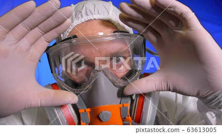 Scientist virologist in respirator. Man close up look, wearing protective medical mask. Concept health safety N1H1 coronavirus epidemic 2019 nCoV. 63613005