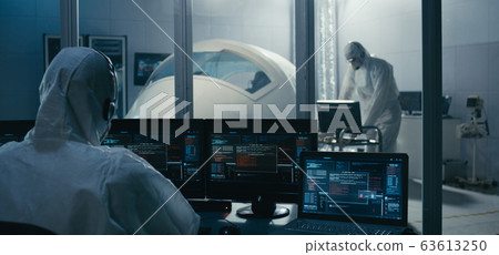 Engineers working in clean room Engineers working in clean room 63613250