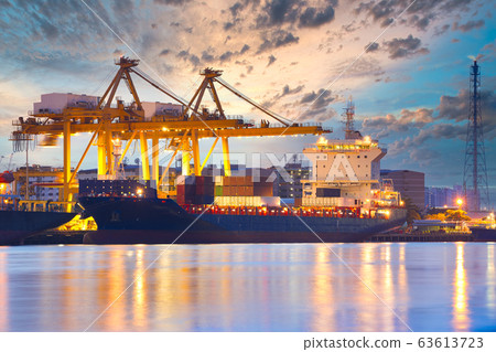 Background for cranes and industrial cargo ships in port at twilight. Background for cranes and industrial cargo ships in port at twilight. 63613723