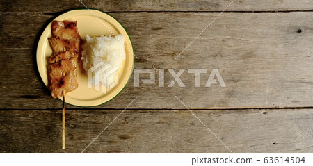 Grilled pork skewers Served with sticky rice. 63614504