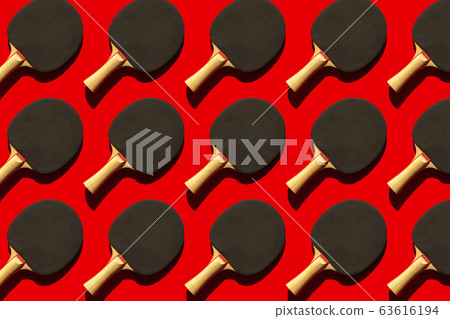 Red background with repeating tennis rackets Red background with repeating tennis rackets 63616194