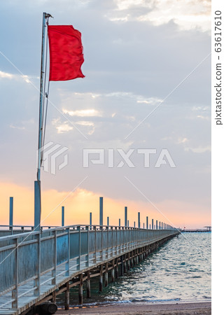 Red flag flying on pontoon bridge Red flag flying on pontoon bridge 63617610