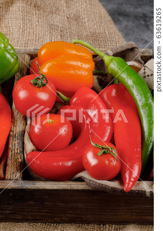 Hot chilies and tomatoes. Top view. Hot chilies and tomatoes. Top view. 63619265