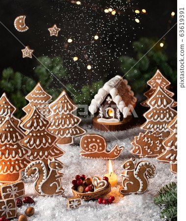 Christmas gingerbread cookies in the form of squirrels and trees 63619391